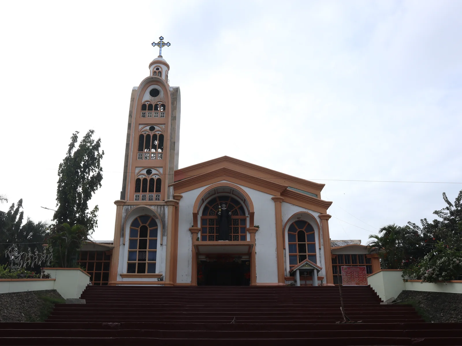 San Juan de Sahagun Parish on S. Osmeña Street, Toledo City, with its bell tower and the steps up to the doors.